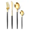 A set of four gold and black cutlery items arranged on a white background. Podgląd zdjęcia produktu
