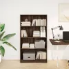 A bookshelf filled with books and storage boxes in a room with a desk and lamp. Podgląd zdjęcia produktu