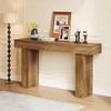 A wooden console table with decorative items on top, placed in a room with a floor lamp. Podgląd zdjęcia produktu