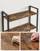 Close-up of a rustic brown shelving unit with black metal frame, featuring detail shots of the shelf's water and scratch resistance. Náhled obrázku produktu