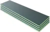 A stack of four dark gray rectangular boards with light green edges, presented on a white background. Produktbild-Vorschau