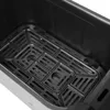 Close-up view of the interior of an air fryer with a metal grate. Podgląd zdjęcia produktu