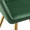 A close-up view of a green velvet chair with gold legs. Produktbild-Vorschau