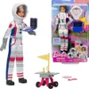 A Barbie astronaut doll and its packaging, along with accessories. Produktbild-Vorschau