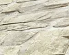 A close-up view of a textured wallpaper with a natural stone appearance. Produktbild-Vorschau