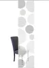 A chair is partially visible next to a decorative panel with a circular pattern. Produktbild-Vorschau