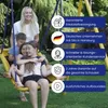 A family on a swing set in a backyard. Anteprima dell’immagine prodotto