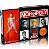 A product shot of the David Bowie Edition Monopoly board game box, with multiple images of David Bowie on the front. Produktbild-Vorschau