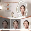 A woman is shown in a mirror with adjustable lighting, demonstrating different brightness levels. Produktbild-Vorschau