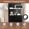 A close-up view of a charging station integrated into a black cabinet, with icons and text describing its features. Náhled obrázku produktu