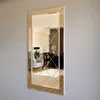 A rectangular mirror with a bronze frame and a beveled, diamond-patterned glass surface, mounted on a light gray wall. Produktbild-Vorschau