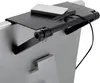 A close-up shot of a black shelf attached to the top of a silver computer monitor or TV screen. Produktbild-Vorschau