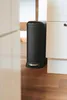 A black pedal bin is shown in a kitchen setting, partially obscured by cabinetry. Produktbild-Vorschau