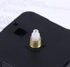 A close-up view of a black clock movement mechanism with a gold and white spindle. Produktbild-Vorschau