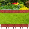A garden scene with flowers and a brick-patterned lawn edging. Produktbild-Vorschau