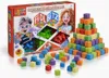 A product shot of a board game box with building blocks arranged in a pyramid and scattered around it. Náhled obrázku produktu