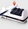 A knife sharpener with a knife being inserted into it. Produktbild-Vorschau