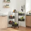 A kitchen scene with a multi-tiered rolling cart filled with fruits and vegetables. Anteprima dell’immagine prodotto