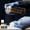 A hand wearing a blue glove sprays an aerosol can onto a white fluffy material. Náhled obrázku produktu