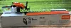 A Stihl hedge trimmer is shown on top of its packaging box, with a grassy background. Produktbild-Vorschau