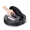 A hand is shown inserting a dustbin into a black robot vacuum cleaner. Podgląd zdjęcia produktu