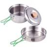A set of camping cookware, including a pot with a lid and a frying pan, displayed against a white background. Produktbild-Vorschau
