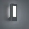 A modern, rectangular LED wall light fixture in an anthracite finish is mounted on a textured gray wall. Produktbild-Vorschau