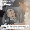 A baby is sitting in a car seat, with a person's hands adjusting the harness. There are icons and text overlayed on the image. Produktbild-Vorschau