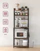 A kitchen shelf unit filled with appliances and decor, standing against a white wall. Náhled obrázku produktu