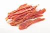 A pile of dried meat strips on a white background. Produktbild-Vorschau