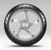 A motorcycle tire and rim against a light gray background. Náhled obrázku produktu