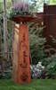 A decorative garden column with a plant bowl on top, placed in a garden setting. Produktbild-Vorschau