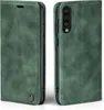 A green flip case for a Samsung Galaxy A70 phone, shown from two angles. Produktbild-Vorschau