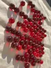 Nahaufnahme transparenter roter 16 mm Glasmurmeln mit glänzender Glasoberfläche und intensiver Farbe Produktbild-Vorschau