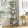 A ladder shelf unit is shown in a room setting next to a desk with a lamp and laptop. Anteprima dell’immagine prodotto