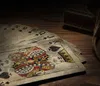 A close-up of vintage playing cards fanned out on a wooden surface, with a hint of a card box and rope in the background. Produktbild-Vorschau