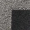 A close-up view of a carpet's texture and edge. Produktbild-Vorschau
