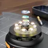 A close-up, exploded view of a digital microscope's internal components, including lenses and LEDs, set against a textured background. Anteprima dell’immagine prodotto