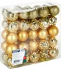 A clear plastic box filled with gold Christmas baubles. Náhled obrázku produktu