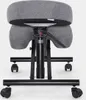 A close-up, rear view of an ergonomic kneeling chair with a gray fabric seat and black metal base with wheels. Produktbild-Vorschau
