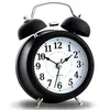 A black retro analog alarm clock with a white face and silver bells is shown against a white background. Voir les images du produit