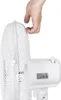 A hand is shown adjusting the protective grill of a white electric fan. Voir les images du produit