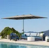 An outdoor patio set with a large umbrella next to a swimming pool. Náhľad obrázku produktu