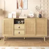 A wooden sideboard with rattan doors and drawers, decorated with a camera, a vase of flowers, and framed pictures. Anteprima dell’immagine prodotto
