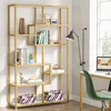 A gold-colored bookshelf with various decorative items and books. Produktbild-Vorschau