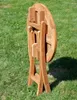 A wooden folding table is shown outdoors on a grassy lawn. Produktbild-Vorschau