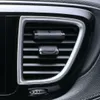 A close-up view of a car's air vent with two air fresheners attached. Anteprima dell’immagine prodotto