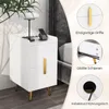 A white nightstand with gold accents is shown next to a bed, with close-up insets highlighting its features. Produktbild-Vorschau