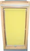 A yellow roller blind is installed in a wooden framed skylight window. Produktbild-Vorschau