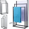 A product image showing a black metal towel rack with two towels draped over it, alongside smaller inset images of the same towel rack. Anteprima dell’immagine prodotto
